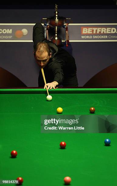 Graeme Dott of Scotland in action against Neil Robertson of Australia during the final of the Betfred.com World Snooker Championships at The Crucible...