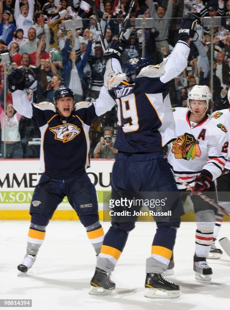 Martin Erat and Jason Arnott of the Nashville Predators celebrate a goal against the Chicago Blackhawks in Game Six of the Western Conference...