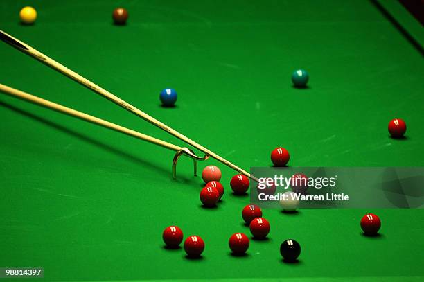 Graeme Dott of Scotland uses a swan neck rest against Neil Robertson of Australia during the final of the Betfred.com World Snooker Championships at...