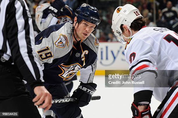 Jason Arnott of the Nashville Predators faces off against Patrick Sharp of the Chicago Blackhawks in Game Six of the Western Conference Quarterfinals...