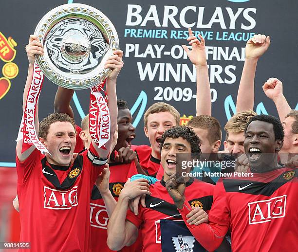 Corry Evans of Manchester United celebrates with the trophy after the Barclays Premier Reserve League Play-Off match between Manchester United...