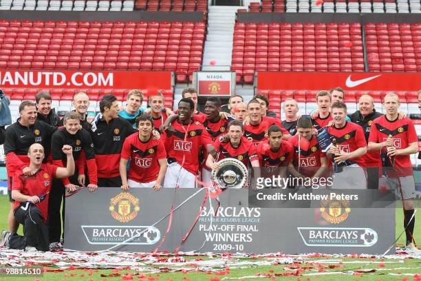 The Manchester United squad celebrates with the trophy after the Barclays Premier Reserve League Play-Off match between Manchester United Reserves...