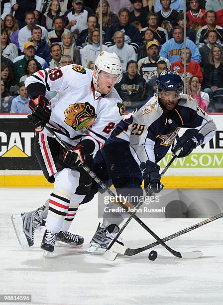 Joel Ward of the Nashville Predators skates against Bryan Bickell of the Chicago Blackhawks in Game Six of the Western Conference Quarterfinals...