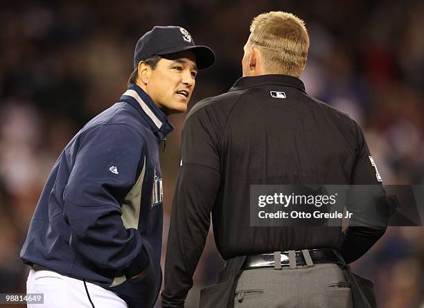 Manager Don Wakamatsu of the Seattle Mariners argues a call with umpire Jim Wolf against the Texas Rangers at Safeco Field on April 30, 2010 in...