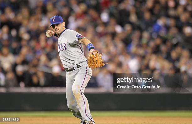 Third baseman Michael Young of the Texas Rangers throws to first against the Seattle Mariners at Safeco Field on April 30, 2010 in Seattle,...