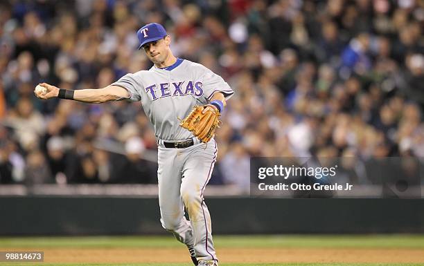 Third baseman Michael Young of the Texas Rangers throws to first against the Seattle Mariners at Safeco Field on April 30, 2010 in Seattle,...