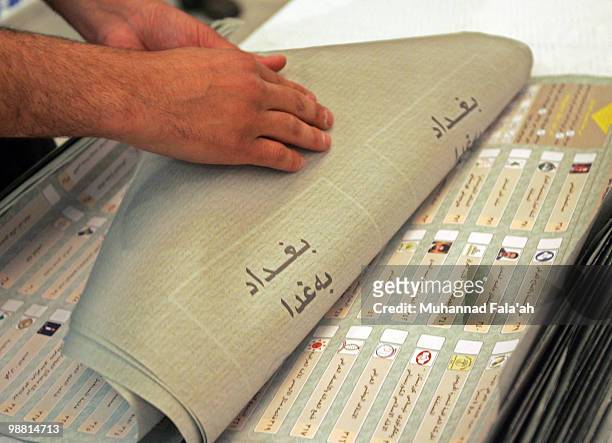 An Iraqi electoral worker counts ballots from the recent parliamentary elections on May 3, 2010 in Baghdad, Iraq. The Iraqi Independent High...
