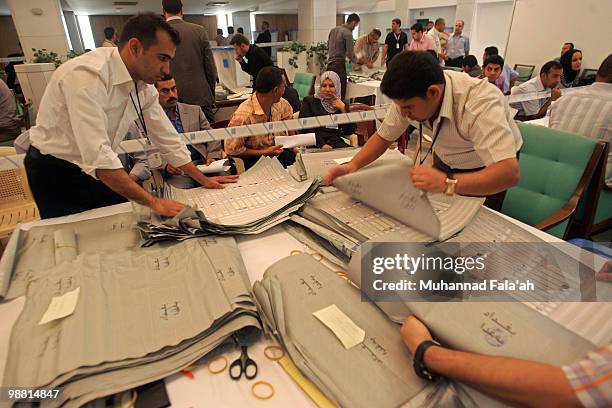 Iraqi electoral workers count ballots from the recent parliamentary elections on May 3, 2010 in Baghdad, Iraq. The Iraqi Independent High Electoral...