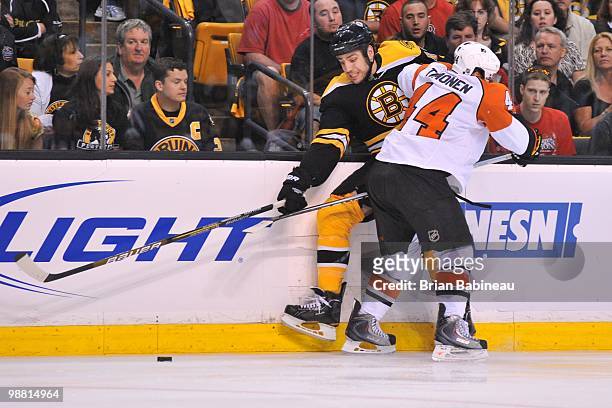 Kimmo Timonen of the Philadelphia Flyers checks Milan Lucic of the Boston Bruins in Game One of the Eastern Conference Semifinals during the 2010 NHL...
