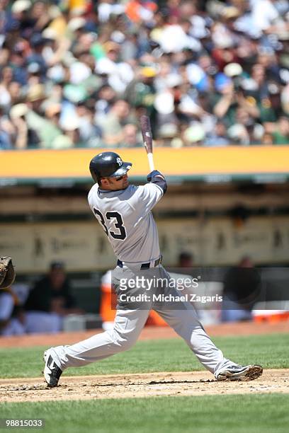 Nick Swisher of the New York Yankees hitting during the game against the Oakland Athletics at the Oakland Coliseum on April 22, 2010 in Oakland,...