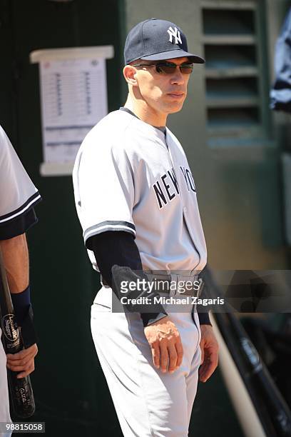 Manager Joe Girardi of the New York Yankees standing in the dugout during the game against the Oakland Athletics at the Oakland Coliseum on April 22,...