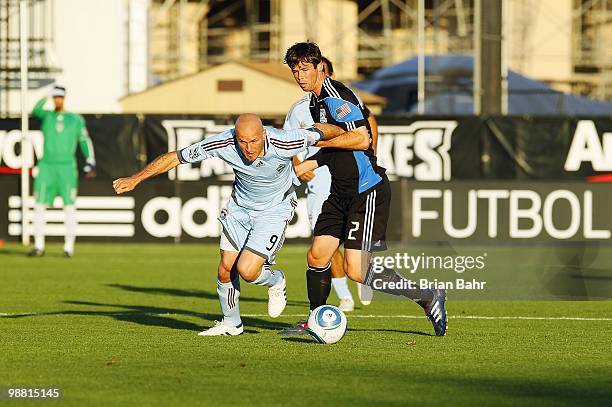 Forward Conor Casey of the Colorado Rapids works to get past defender Bobby Burling of the San Jose Earthquakes on May 1, 2010 at Buck Shaw Stadium...