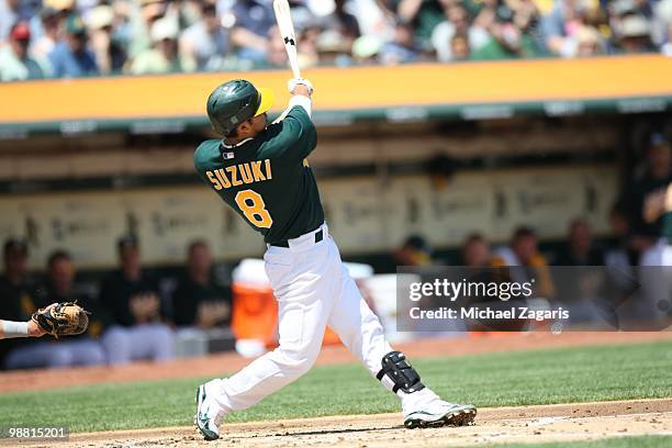 Kurt Suzuki of the Oakland Athletics hitting a three-run home run during the game against the New York Yankees at the Oakland Coliseum on April 22,...