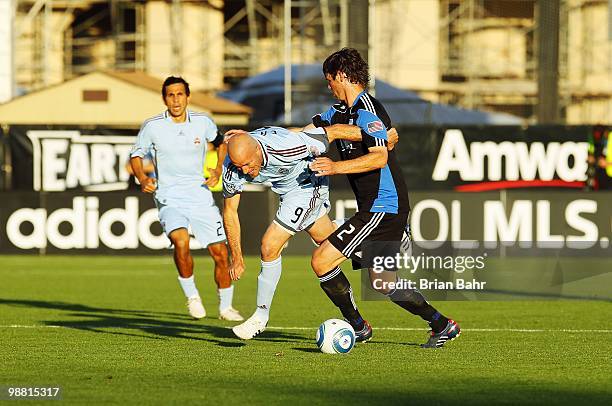 Forward Conor Casey of the Colorado Rapids works to get past defender Bobby Burling of the San Jose Earthquakes on May 1, 2010 at Buck Shaw Stadium...