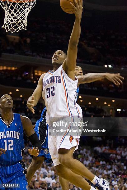 Boris Diaw of the Charlotte Bobcats drives to the basket past Dwight Howard of the Orlando Magic at Time Warner Cable Arena on April 26, 2010 in...