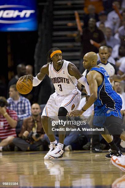 Gerald Wallace of the Charlotte Bobcats tries to back down Vince Carter of the Orlando Magic at Time Warner Cable Arena in Game Four of the Eastern...