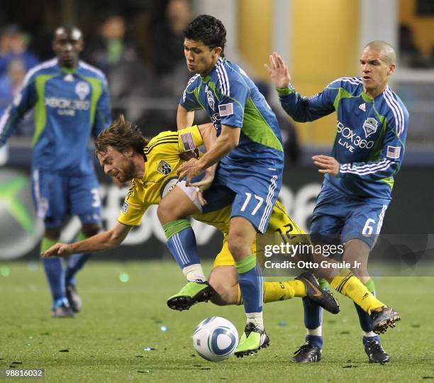 Fredy Montero of the Seattle Sounders FC in action against Eddie Gaven of the Columbus Crew on May 1, 2010 at Qwest Field in Seattle, Washington.