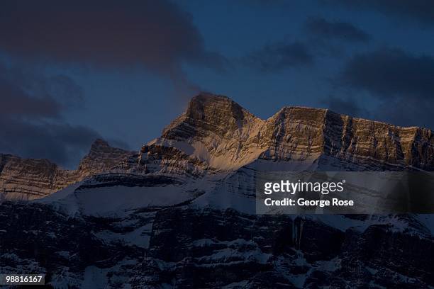 The dramatic snow covered granite face of Mt. Rundle is seen in this 2010 Banff Springs, Canada, early morning landscape photo.
