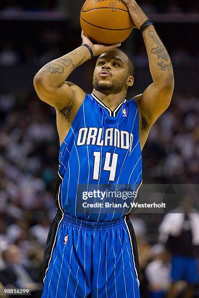Jameer Nelson of the Orlando Magic shoots a free throw against the Charlotte Bobcats at Time Warner Cable Arena on April 26, 2010 in Charlotte, North...
