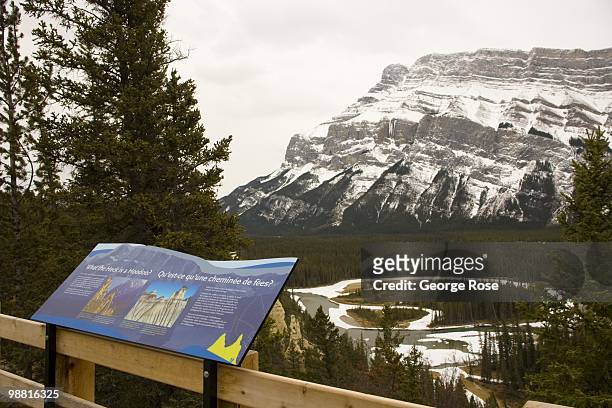 The dramatic snow covered granite face of Mt. Rundle is seen in this 2010 Banff Springs, Canada, early evening landscape photo taken looking across a...