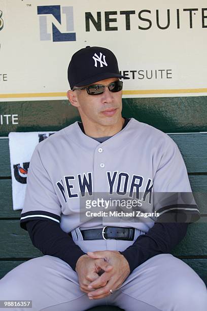 Manager Joe Girardi of the New York Yankees sitting in the dugout prior to the game against the Oakland Athletics at the Oakland Coliseum on April...