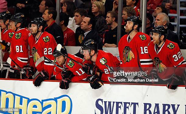 Marian Hossa, Troy Brouwer, John Madden, Bryan Bickell, Andrew Ladd and Kris Versteeg of the Chicago Blackhawks watch as teammates take on the...
