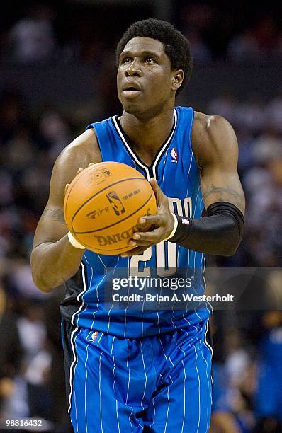 Mickael Pietrus of the Orlando Magic shoots a free throw against the Charlotte Bobcats at Time Warner Cable Arena on April 26, 2010 in Charlotte,...