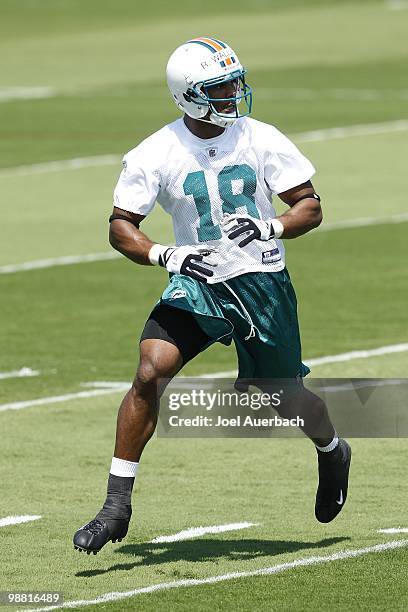 Roberto Wallace of the Miami Dolphins runs to catch a pass during the rookie mini camp April 30, 2010 at the Miami Dolphins training facility in...