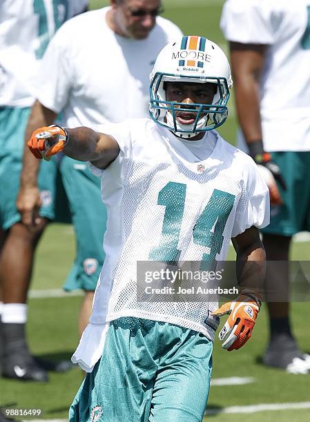 Marlon Moore of the Miami Dolphins points prior to running a route during the rookie mini camp April 30, 2010 at the Miami Dolphins training facility...