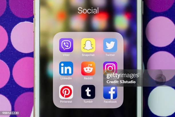 Smart phone with the icons for the social networking apps Viber, Snapchat, Twitter, Linkedin, Reddit, Instagram, Pinterest, Tumblr, and Facebook are...