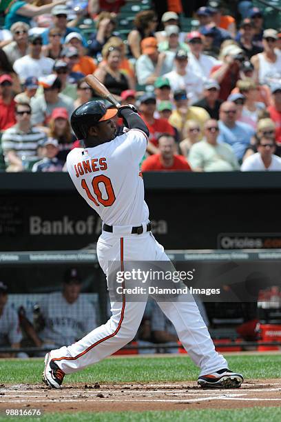 Outfielder Adam Jones of the Baltimore Orioles swings at a pitch during the bottom of the first inning of a game on May 2, 2010 against the Boston...