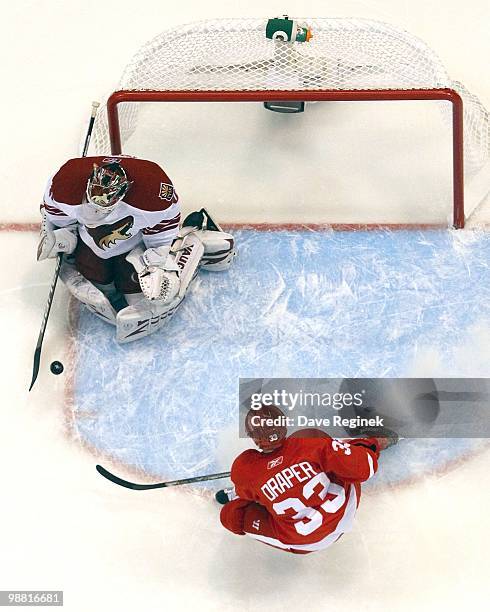 Goaltender Ilya Bryzgalov of the Phoenix Coyotes makes a save on Kris Draper of the Detroit Red Wings during Game Six of the Western Conference...