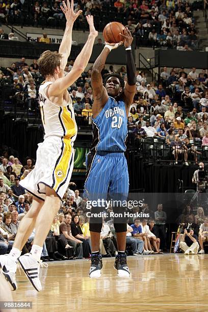 Mickael Pietrus of the Orlando Magic shoots the outside jump shot against Mike Dunleavy of the Indiana Pacers during the game at Conseco Fieldhouse...