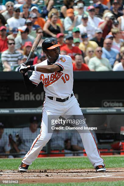 Outfielder Adam Jones of the Baltimore Orioles swings at a pitch during the bottom of the first inning of a game on May 2, 2010 against the Boston...