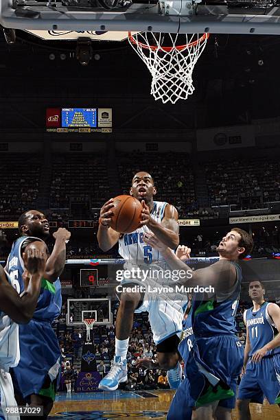 Marcus Thornton of the New Orleans Hornets makes a layup against Kevin Love of the Minnesota Timberwolvesduring the game at New Orleans Arena on...