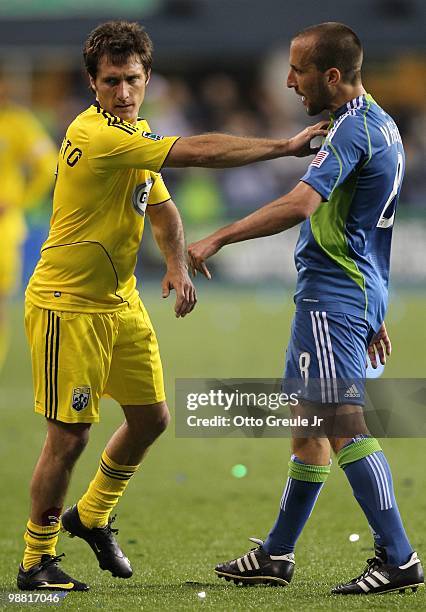 Guillermo Barros Schelotto of the Columbus Crew pushes away Peter Vagenas of the Seattle Sounders FC on May 1, 2010 at Qwest Field in Seattle,...