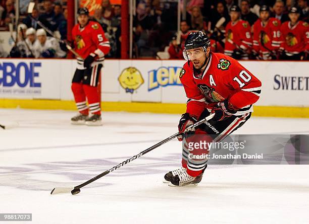 Patrick Sharp of the Chicago Blackhawks controls the puck against the Vancouver Canucks in Game One of the Western Conference Semifinals during the...