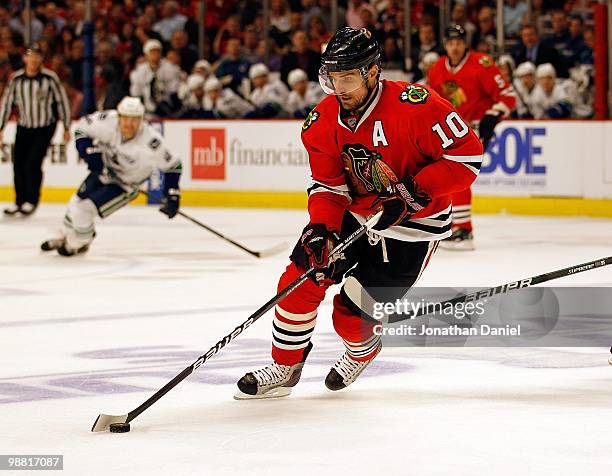 Patrick Sharp of the Chicago Blackhawks controls the puck against the Vancouver Canucks in Game One of the Western Conference Semifinals during the...