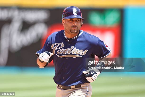 Yorvit Torrealba of the San Diego Padres circles the bases after hitting a home run during a MLB game against the Florida Marlins in Sun Lite Stadium...