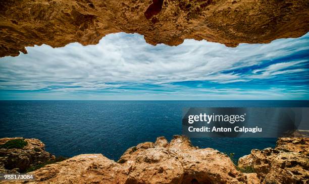 seascape ... cueva cap de barbaria , formentera - cueva stockfoto's en -beelden