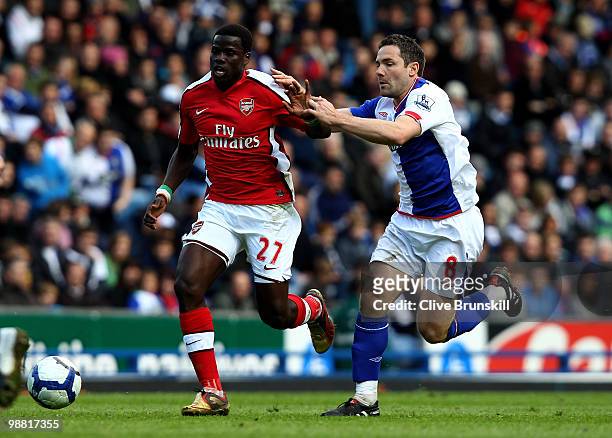 Emmanuel Eboue of Arsenal holds off a challenge from David Dunn of Blackburn Rovers during the Barclays Premier League match between Blackburn Rovers...