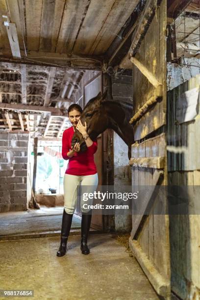 jockey hugging horse - grace tame stock pictures, royalty-free photos & images