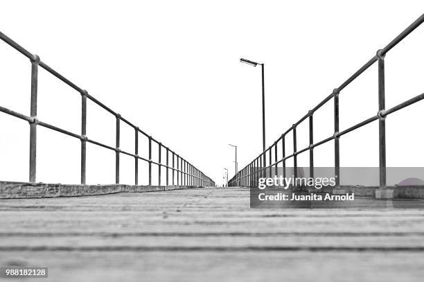 endless jetty (black & white) - badalona stock pictures, royalty-free photos & images