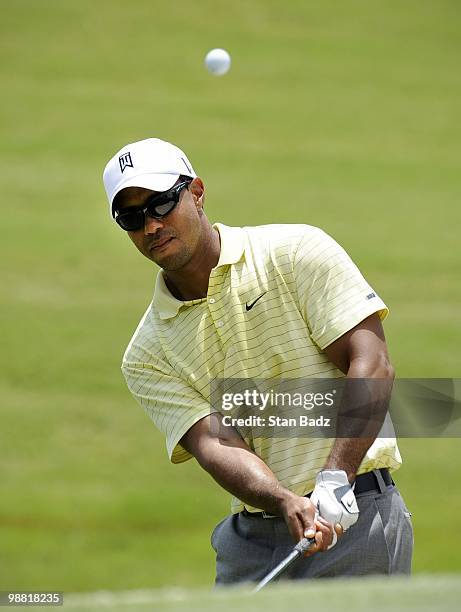 Tiger Woods chips onto the second green during his practice round for THE PLAYERS Championship on THE PLAYERS Stadium Course at TPC Sawgrass on May...