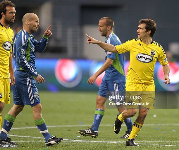 Guillermo Barros Schelotto of the Columbus Crew and Freddie Ljungberg of the Seattle Sounders FC point at each other on May 1, 2010 at Qwest Field in...