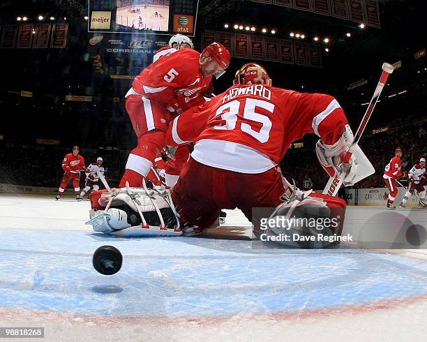Jimmy Howard of the Detroit Red Wings is scored on as teammate Nicklas Lidstrom defends the net during Game Six of the Western Conference...