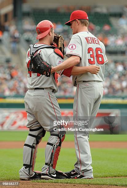 Mike Napoli and Jered Weaver of the Los Angeles Angels of Anaheim talk on the field against the Detroit Tigers during the game at Comerica Park on...