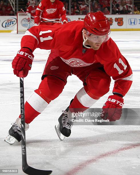 Dan Cleary of the Detroit Red Wings skates hard to the net with the puck during Game Six of the Western Conference Quarterfinals of the 2010 NHL...