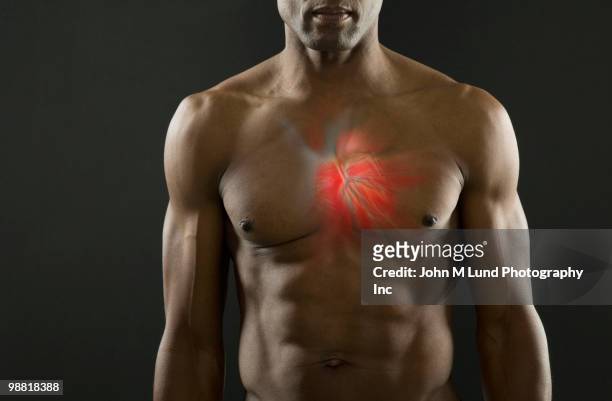 african american man with glowing heart - blutkreislauf stock-fotos und bilder