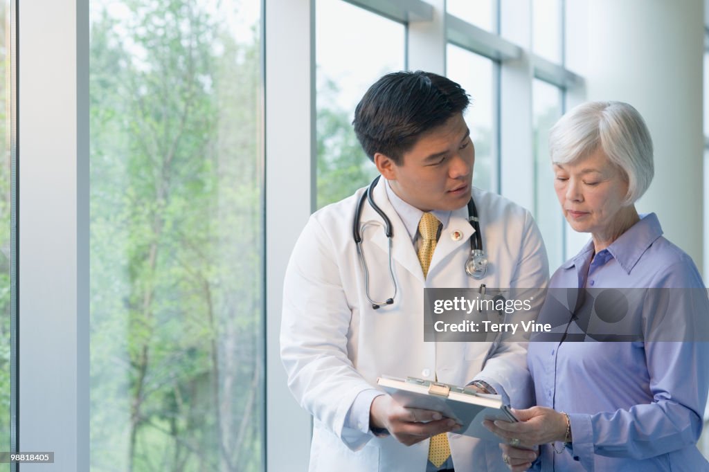 Chinese doctor talking to woman